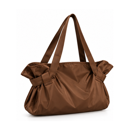 DAYYN brown convertible tote bag against a white background